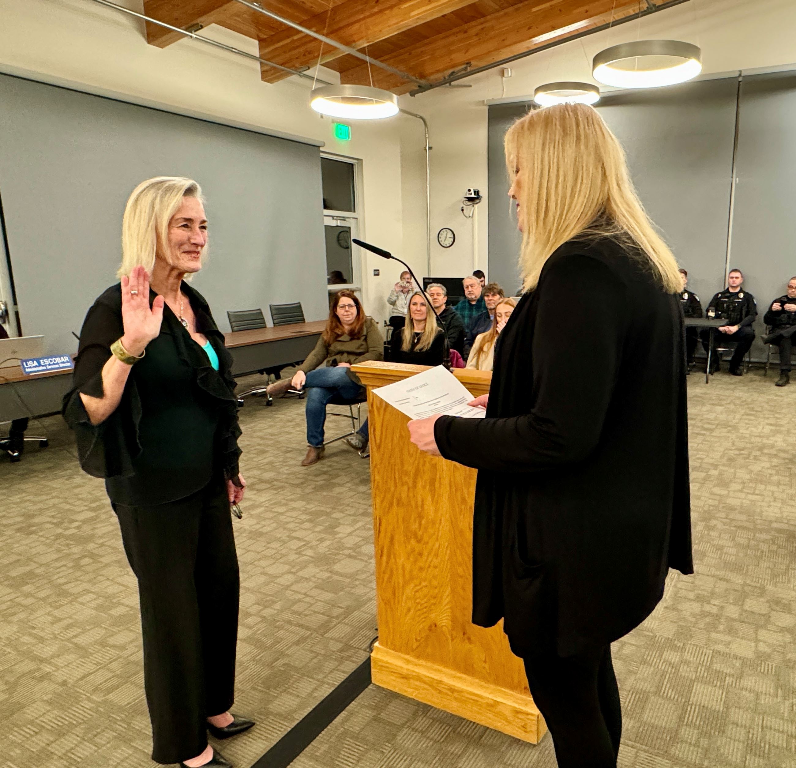 Mayor Mary Miller being sworn in by City Clerk Susie Oppedal
